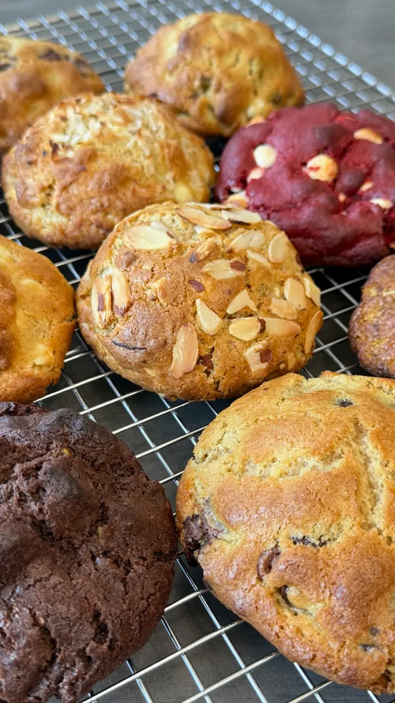A close-up of freshly baked Sweet Moon stuffed cookies with melting chocolate centers